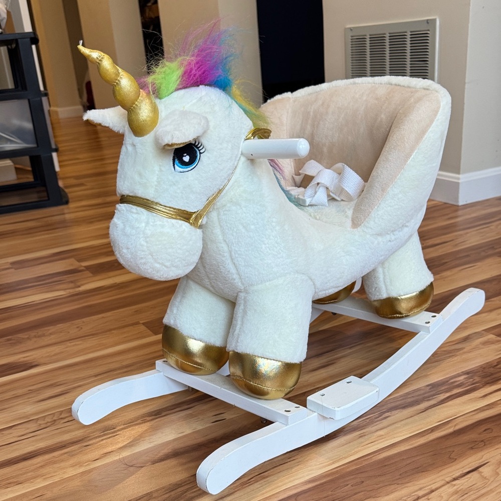 Plush Unicorn Rocker with Gold Accents and adorable sounds!  Safety seating!